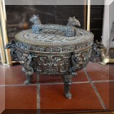 D83. Chinese reproduction metal tripod pot with greek key and dragon design. 12”h x 9”w - $48 